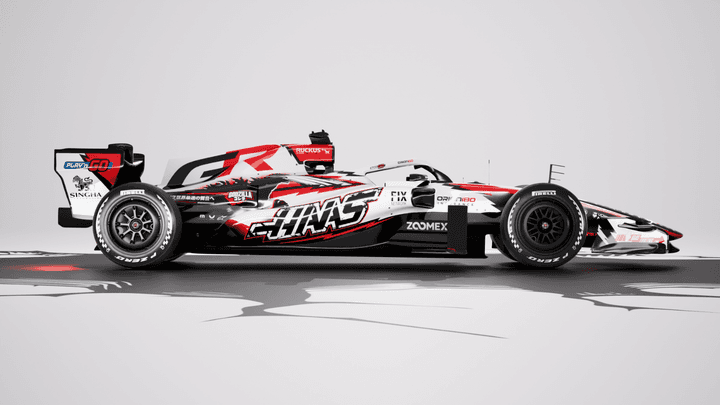 Monoplace Haas F1 avec livrée spéciale Godzilla rouge et noire sur fond neutre